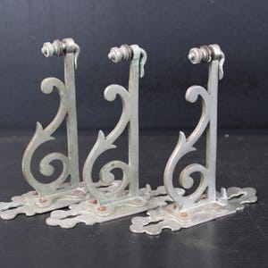 Antique set of three chrome plated bathroom brackets for glass shelf.