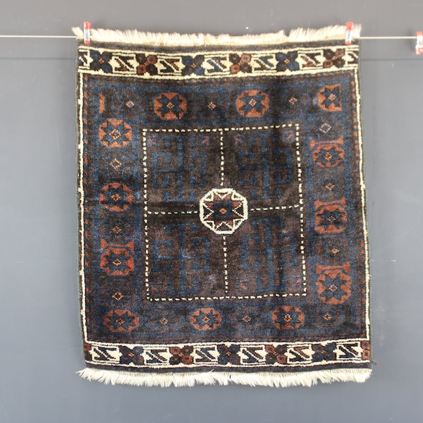 Antique handwoven Persian Baluch bag face rug.