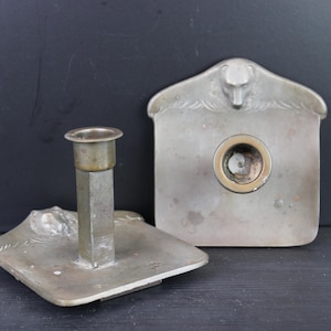 Art Nouveau pair of candle holders with wolfs heads.