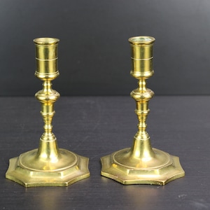 Antique pair of brass bronze candle holders.