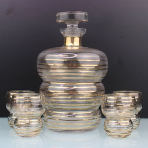Art Deco glass with gold lines liquor set.