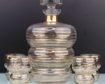 Art Deco glass with gold lines liquor set.