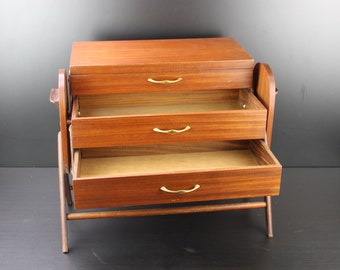 A Vintage mid century modernism wooden sewing box.