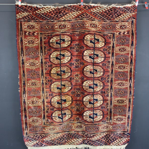 Antique handwoven Persian Turkmen Baluch tribal rug.