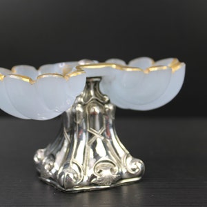 Antique Victorian salt and pepper set with silver foot.