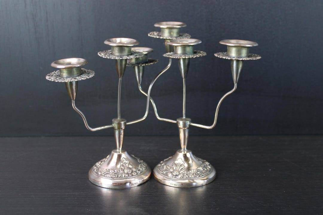 Antique pair of floral brass candle holders