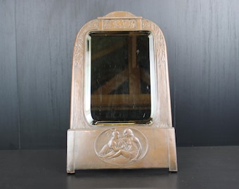 Art Nouveau bronze colored table mirror.