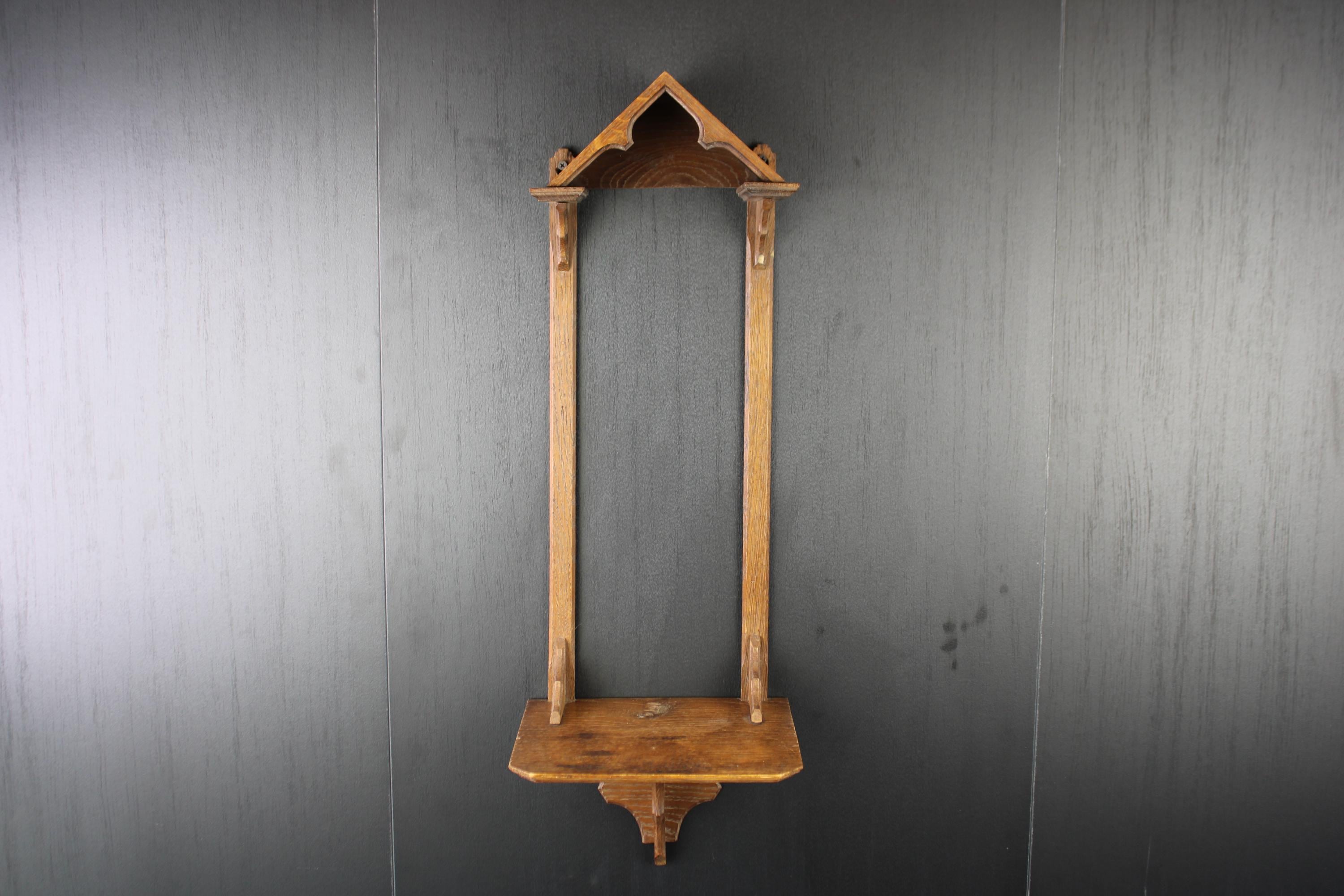 Antique Gothic oak wooden wall shelf.