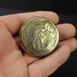 Art Nouveau brass floral lady face pill snuff box.