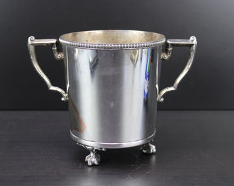 A Vintage silver plated ice bucket with claw feet.