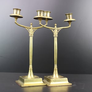 Jugendstil pair of bronze candle holders in the style of Jan Eisenloeffel.