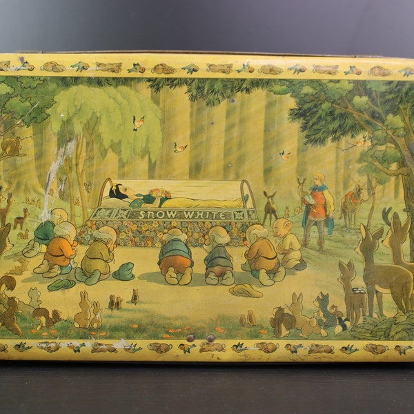 Antique Walt Disney Snow White and the seven dwarfs biscuit storage tin.