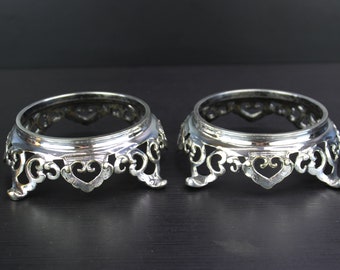 Antique pair of silver plated round vase display stands.