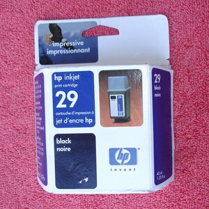 May include: A white box with blue and black accents for an HP 29 black inkjet print cartridge. The box has the text "impressive impressionnant" on the top and "hp invent" on the bottom. The cartridge is for use with HP inkjet printers.