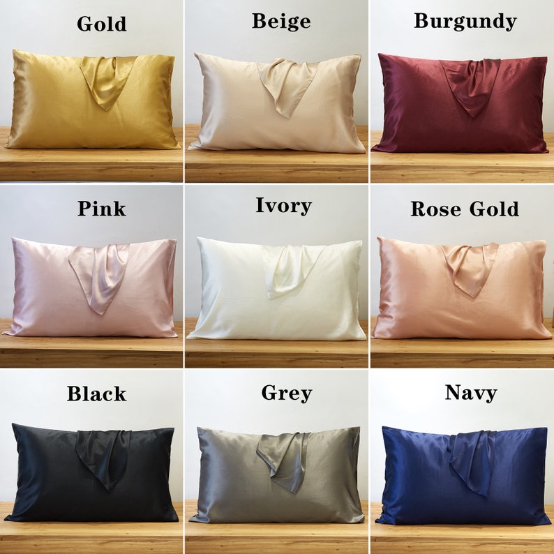 May include: Nine different colored satin pillowcases with a matching satin fabric folded on top. The colors are gold, beige, burgundy, pink, ivory, rose gold, black, grey, and navy.
