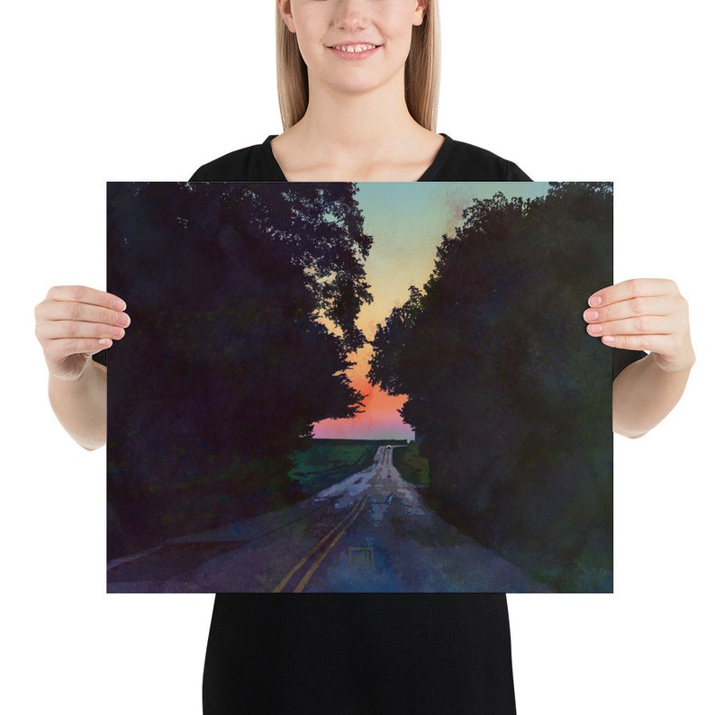 May include: A long, straight road with yellow lines down the center leads through a forest towards a colorful sunset. The road is wet and reflects the sky.