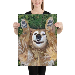 May include: A golden retriever dog lying on its back with its paws in the air, smiling with its tongue out. The dog is on a green grassy background.