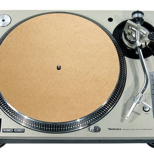May include: A silver Technics SL-1200MK3D direct drive turntable. It has a brown platter, a silver tonearm, and a start/stop button. The text "Technics" is visible on the front.