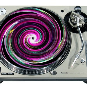 May include: A silver turntable with a black and pink swirl design slipmat. The turntable has a silver tone arm and a black needle.