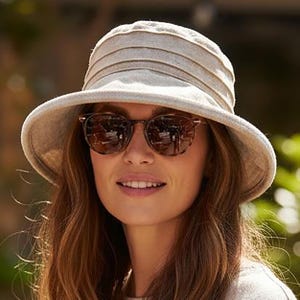 May include: A set of three ceramic mugs with a speckled, matte finish. The mugs are in shades of cream, light gray, and dark gray. Each mug has a simple, minimalist design and a rounded handle. Perfect for coffee or tea.