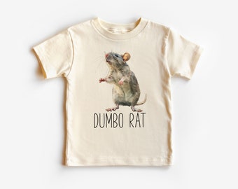 May include: A cream colored t-shirt with a cartoon illustration of a gray rat with large ears. The text "DUMBO RAT" is printed below the rat.