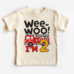 May include: A white t-shirt with a red fire truck and the text "Wee-Woo! I'm 2" in black and yellow.