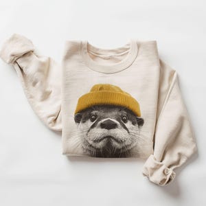 Retro River Otter Wearing Beanie Unisex Sweatshirt