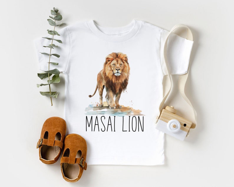 May include: White t-shirt with a watercolor illustration of a lion and the text "MASAI LION".