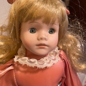 Vintage Porcelain Doll Blonde in rose pink dress with matching hair bow