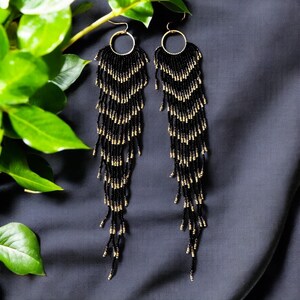 Black & Gold Glass Beaded Chandelier Earrings: Cascading Feather Design