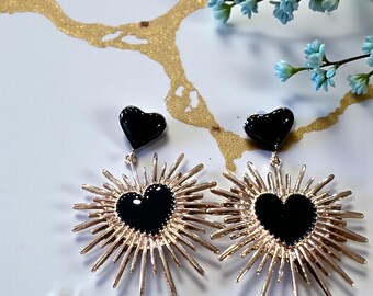 Black and Gold Toned Dangling Starburst Enamel Heart Earrings