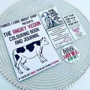 The Angry Vegan - colouring book and journal for adults + vegan activism stickers.
