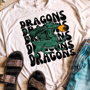 May include: A white t-shirt with a green dragon graphic and the text "DRAGONS" in black. The dragon is breathing fire and the text is in a retro font.
