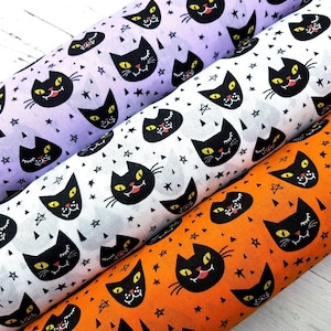 Halloween Katzen Stoff, Polycotton Stoff, Halloween Katzen Druck in Orange/Lila/Weiß, gruselige Katzen Gesichter von einem halben Meter