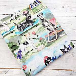 May include: A light blue and white fabric with a colorful print of dogs enjoying leisure activities. The dogs are depicted skateboarding, relaxing in beach chairs, and playing in a garden setting with flowers.