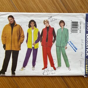 May include: A sewing pattern for a women's jacket and pants set. The pattern is for sizes 22W-24W-26W and is from Butterick pattern number 5890. The pattern is for a jacket and pants set. The jacket is a zip-up jacket with a stand-up collar. The pants are a straight-leg pant. The pattern is for a view called "Frants" and is from October 2013.