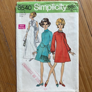 May include: Vintage Simplicity sewing pattern featuring three dress designs. The pattern cover is primarily white and green, with illustrations of the dresses in white, teal, and red. The bust size is 36 inches, and the waist is 27 inches.