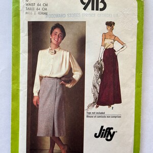 May include: Vintage Simplicity sewing pattern 9113. The pattern features illustrations of a skirt and blouse. The pattern includes the text "WAIST 64 CM" and "MISS J. FEMME". The pattern is green and white.