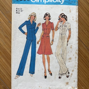 May include: A vintage Simplicity sewing pattern for a women's jumpsuit. The pattern is for size 16, bust 38 inches, and is for misses. The pattern shows three different styles of jumpsuits, one in blue, one in red, and one in white.