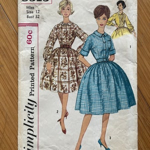 May include: Simplicity sewing pattern number 3513 for a dress. The pattern is for a miss size 12 with a bust of 32 inches. The pattern shows two different dresses, one with a brown and white checked pattern and the other with a blue and white checked pattern.