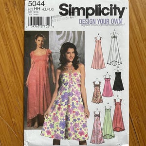 May include: Simplicity sewing pattern number 5044 for sizes 6, 8, 10, and 12. The pattern includes instructions for making eight different styles of dresses, all with a similar design. The dresses are shown in various colours, including pink, green, black, and white.