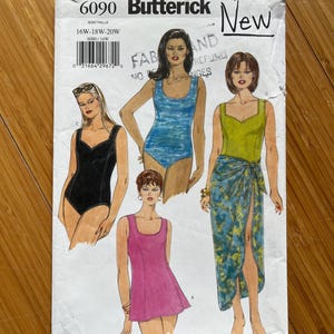 May include: A vintage Butterick sewing pattern envelope, featuring illustrations of swimwear designs. The envelope displays the number 6090, size information, and the word "New". The illustrations showcase various swimsuit styles in black, blue, and pink.