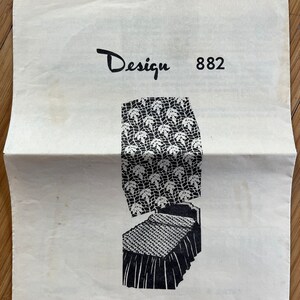 May include: Black and white illustration of a bedspread and accessories design, labeled "Design 882" and "Bedspread and Accessories".