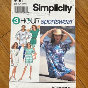 May include: Simplicity sewing pattern number 8491 for sportswear. The pattern includes four different styles of tops, all with short sleeves. The pattern is for sizes XS-MD and is labeled as a 3 Hour project.