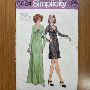 May include: Vintage Simplicity sewing pattern 6024. The pattern features illustrations of two dresses. The pattern includes sizes 9jp and 11jp, with bust sizes 33 and 34 inches. The pattern is for Junior Petite sizes.