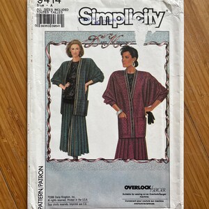 May include: Simplicity sewing pattern number 9414, size A, for a jacket and skirt. The pattern includes instructions for sewing on an overlock/serger machine. The pattern is printed on white paper with a pink and white floral design.
