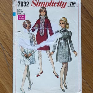 May include: Vintage Simplicity sewing pattern number 7932 for a junior size 11 dress with a bust measurement of 85 cm. The pattern includes three different dress styles, each with a different neckline and sleeve length. The pattern is printed on white paper with black text and illustrations.