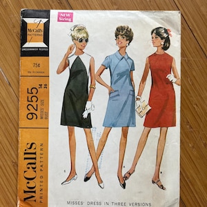 May include: Vintage McCall's sewing pattern for a misses' dress in three versions. The pattern number is 9255, size 14, bust 36. The pattern features three women wearing different versions of the dress: black and white, light blue, and red.