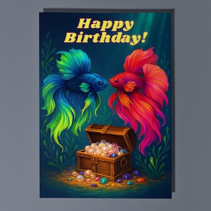 May include: A birthday card with a vibrant illustration of two Siamese fighting fish. One is blue and green, the other red and pink. A wooden treasure chest filled with pearls is at the bottom. The words "Happy Birthday!" are at the top.
