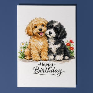 May include: A birthday card featuring two adorable puppies. One is golden, the other black and white, both with happy expressions. The card has the words "Happy Birthday" in elegant script, with small flowers and greenery.